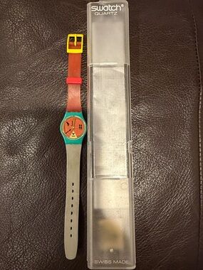 Vintage 1986 Swatch Lady HORUS LL101 Watch – Teal Case, Orange Hieroglyph Dial